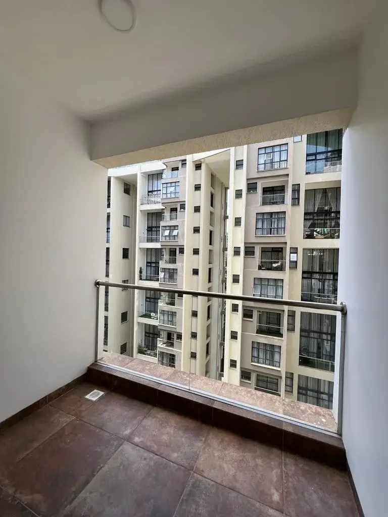 Balcony with railing overlooking residential apartment complex
