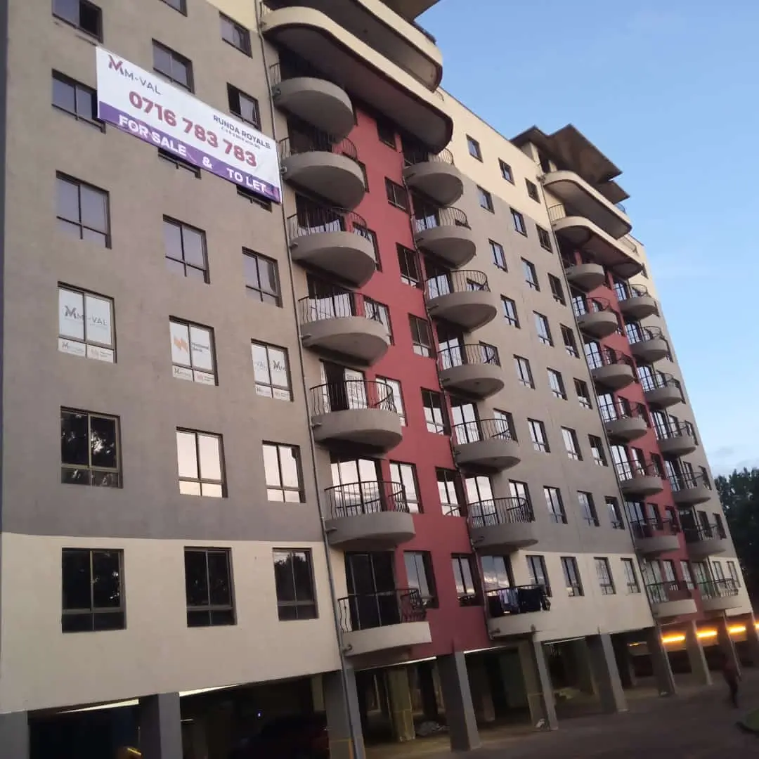 Modern multi-story residential building with curved balconies