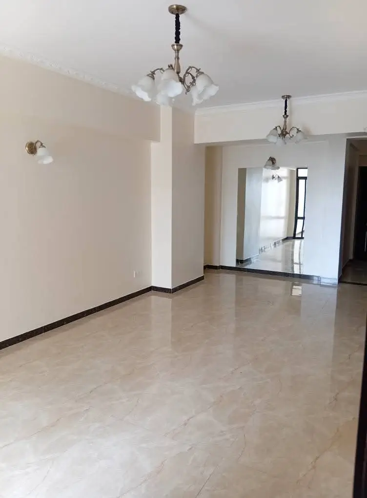 Spacious open-plan living area with polished marble flooring