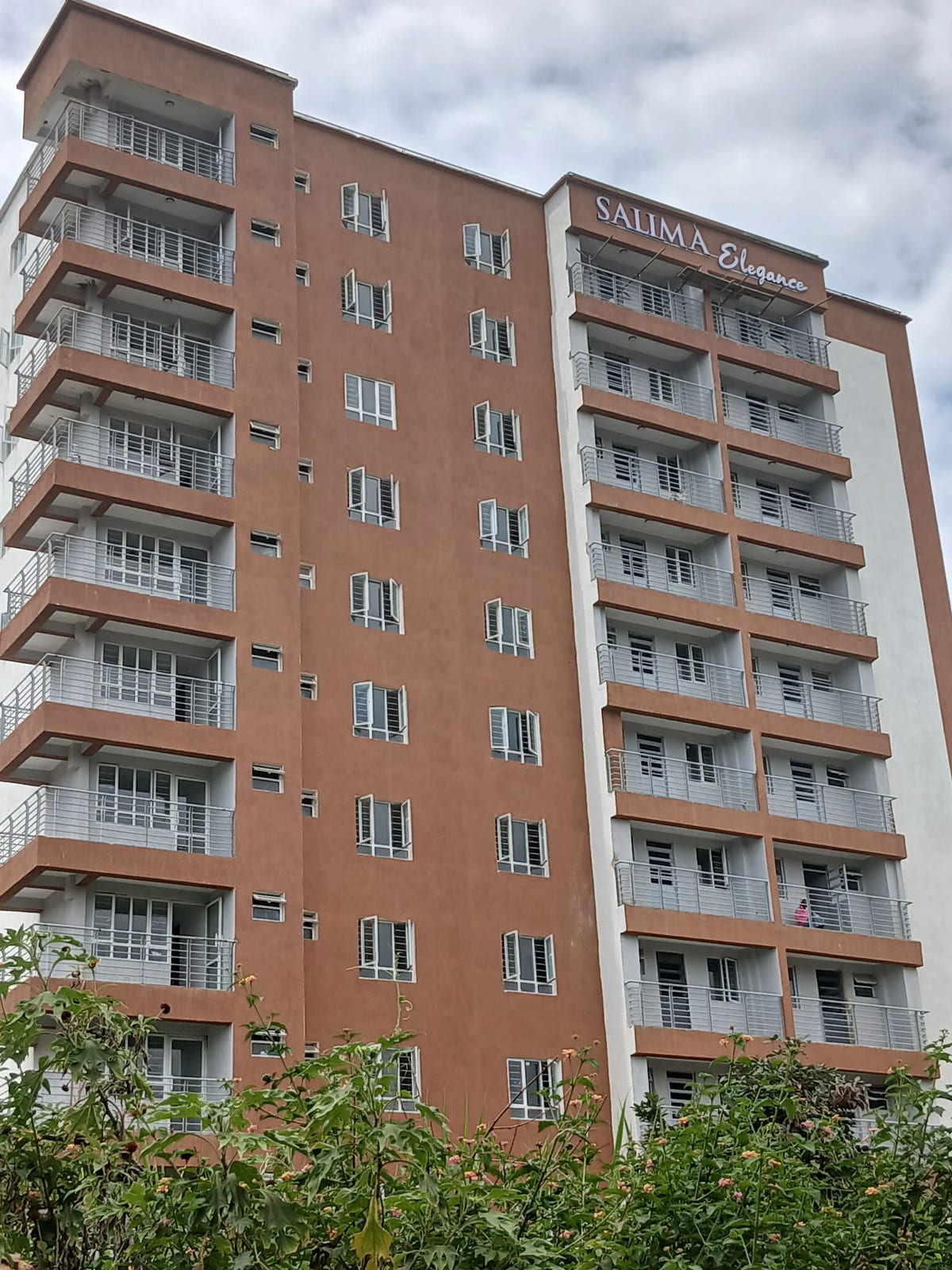 Multi-story residential building with brick facade and balconies