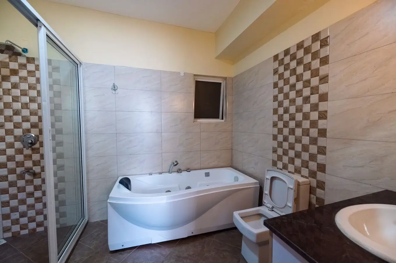 Spacious bathroom with jacuzzi tub, shower cubicle, dual sink