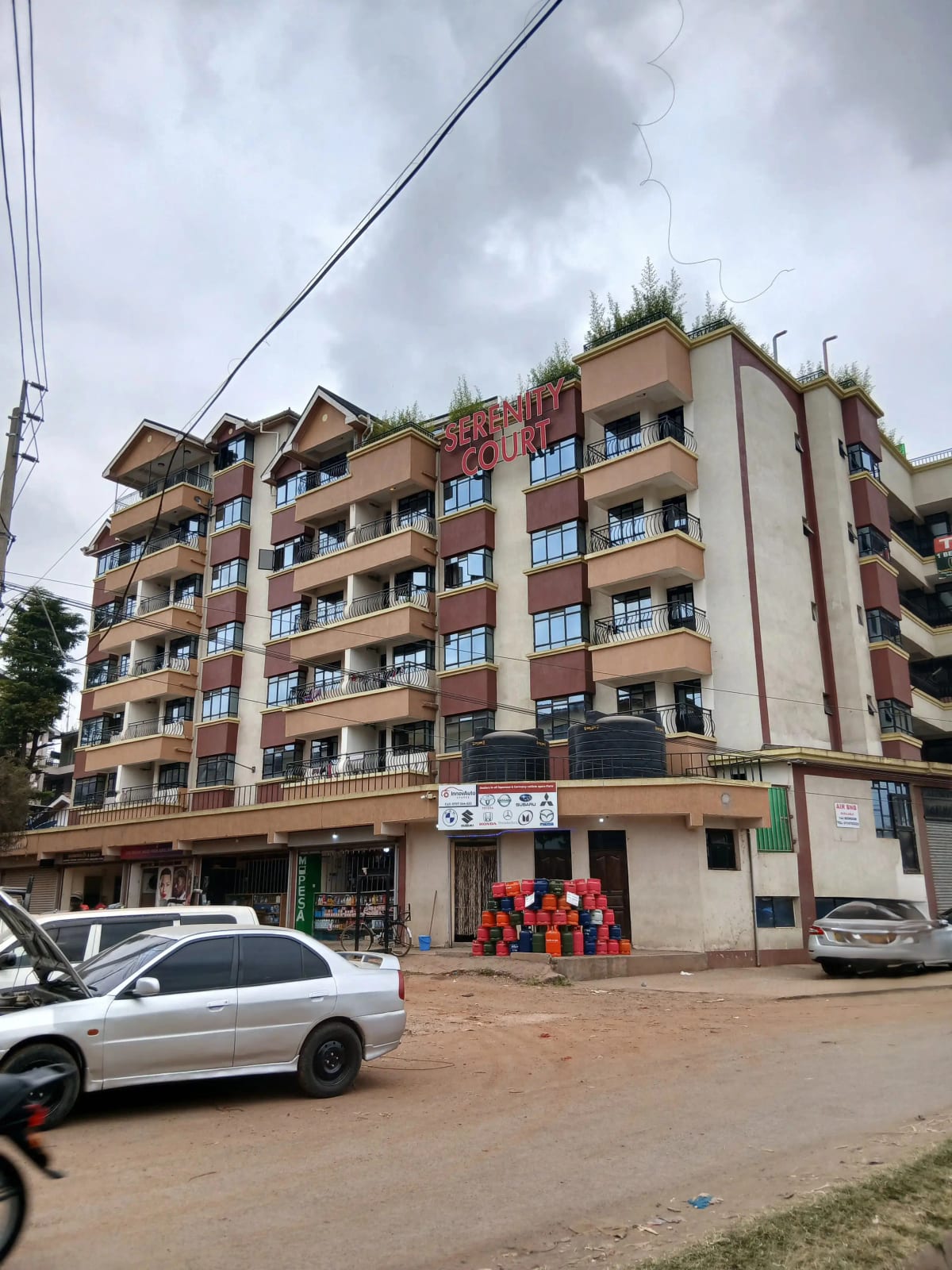 Multi-story residential building with ground-floor commercial units