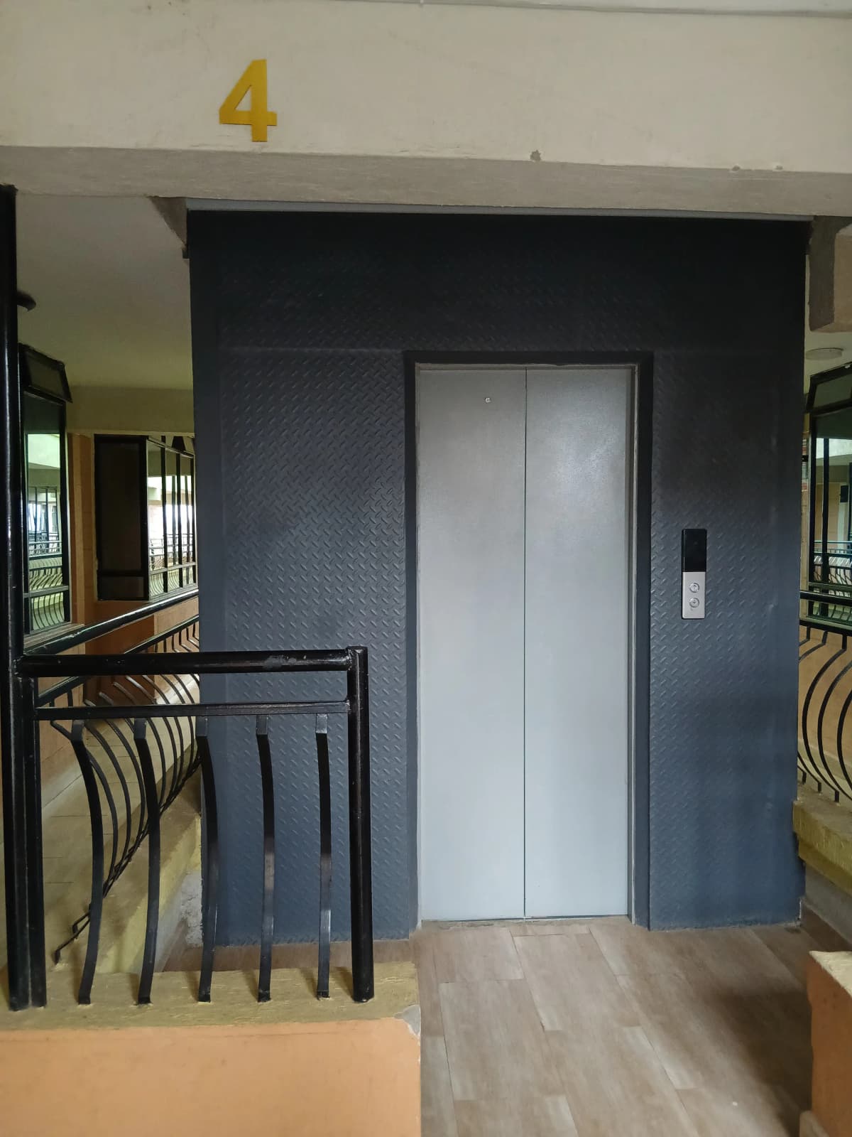 Building lobby with elevator and numbered floor marker