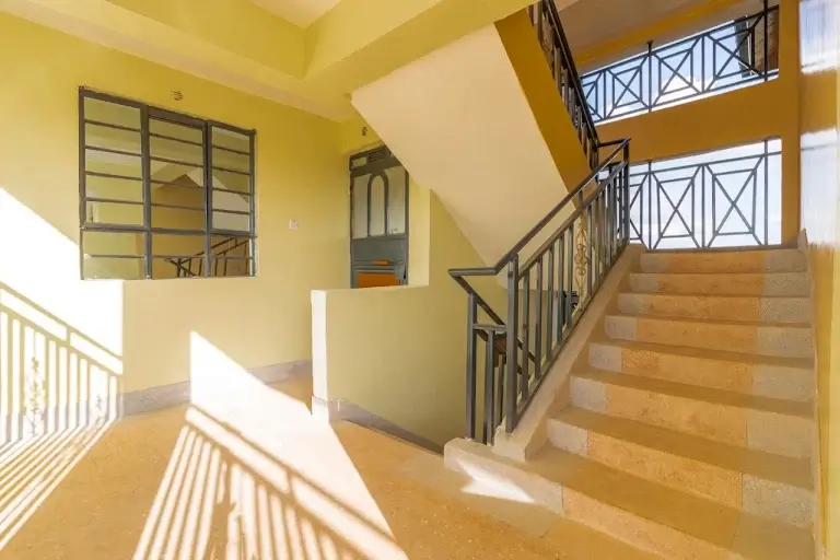 Bright stairwell with natural light and metal railings