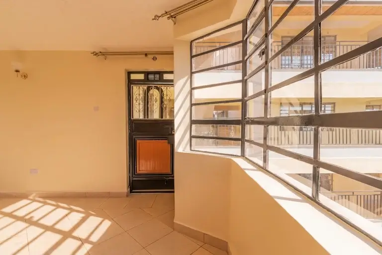 Bright balcony with steel railings and city views