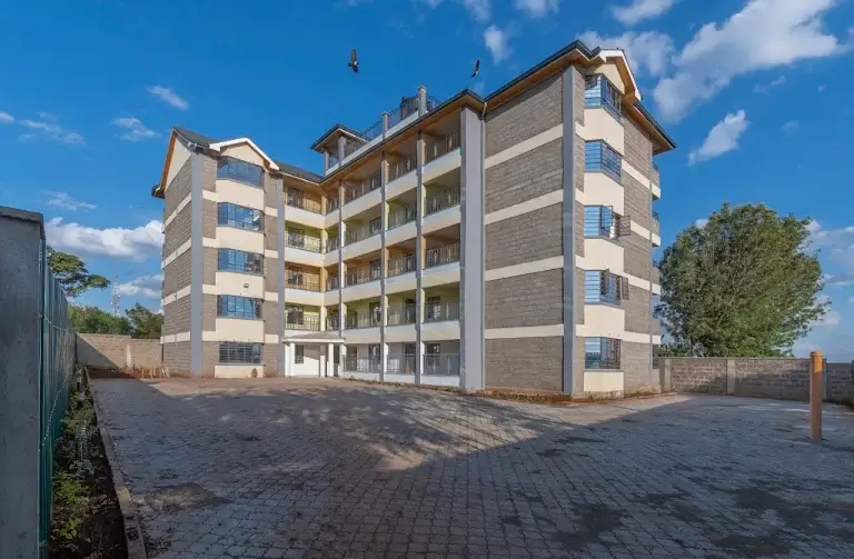 Modern multi-story residential building with brick and cement facade