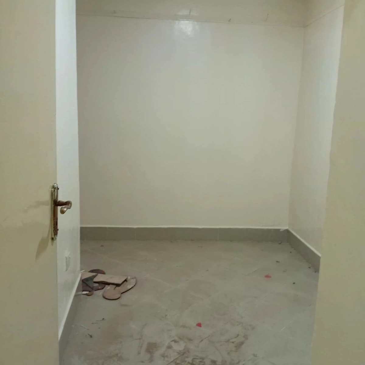 Empty utility storage room with concrete floor, unfinished