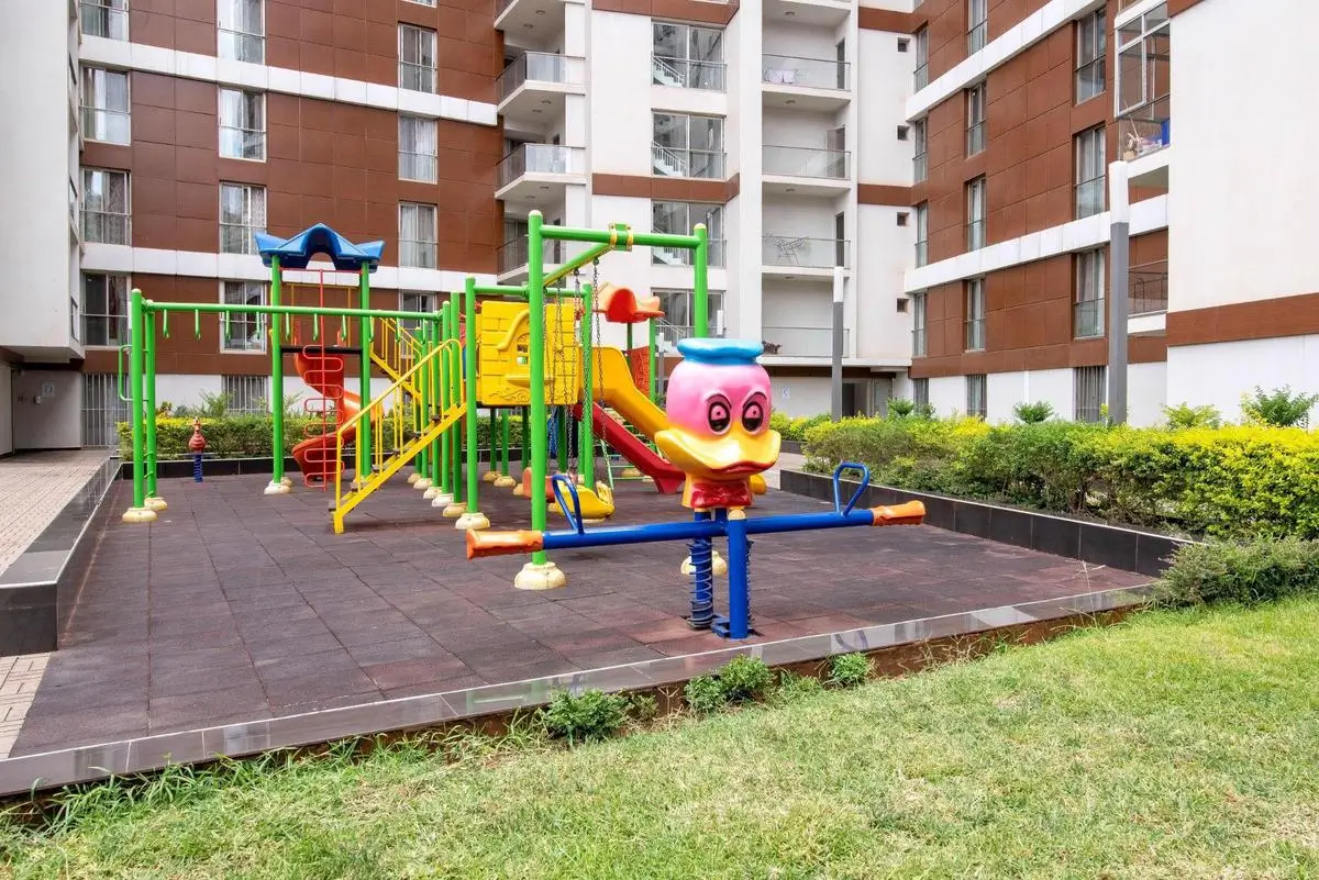 Children's playground with colorful equipment in compound grounds