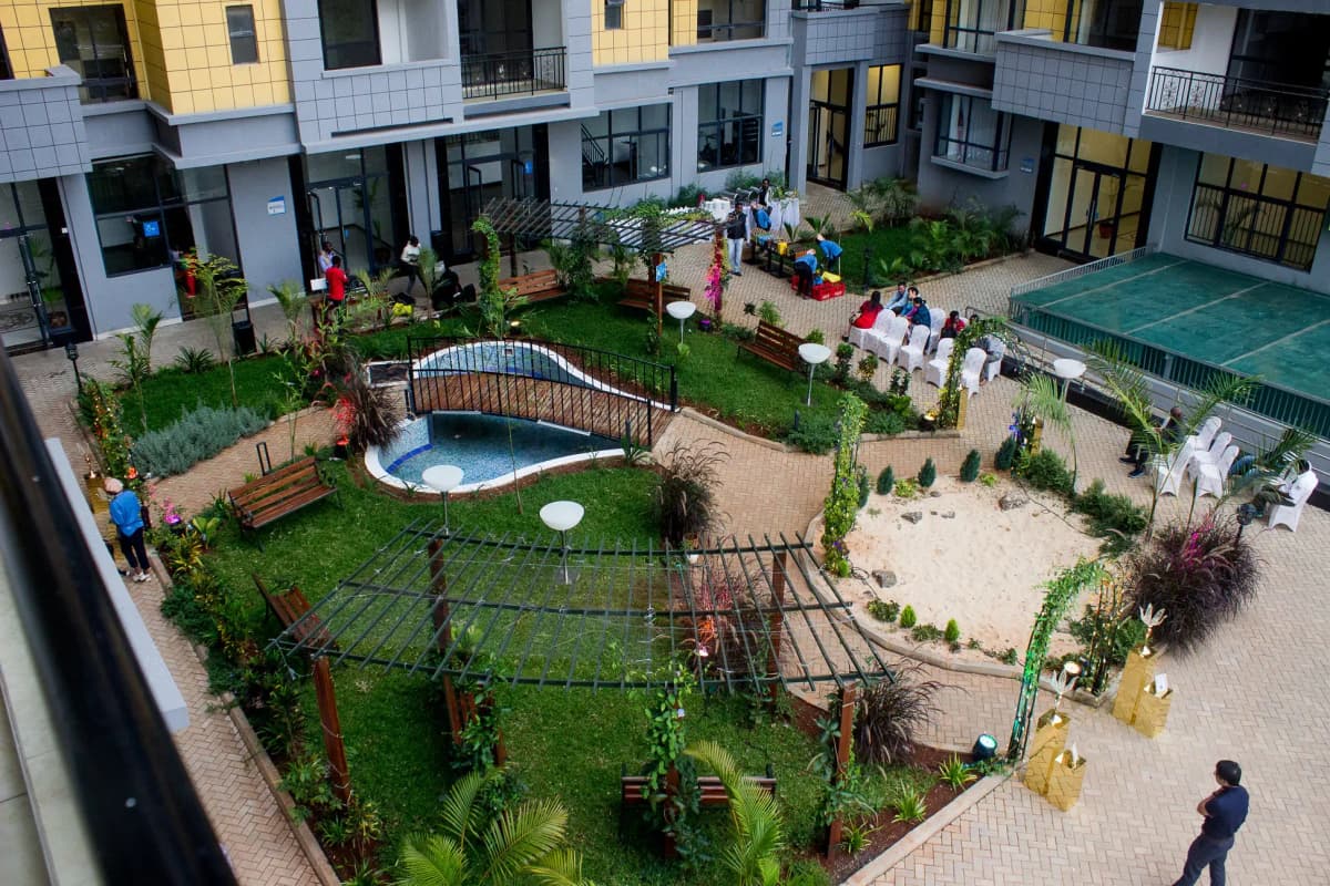 Spacious compound with pool, manicured lawns, seating areas
