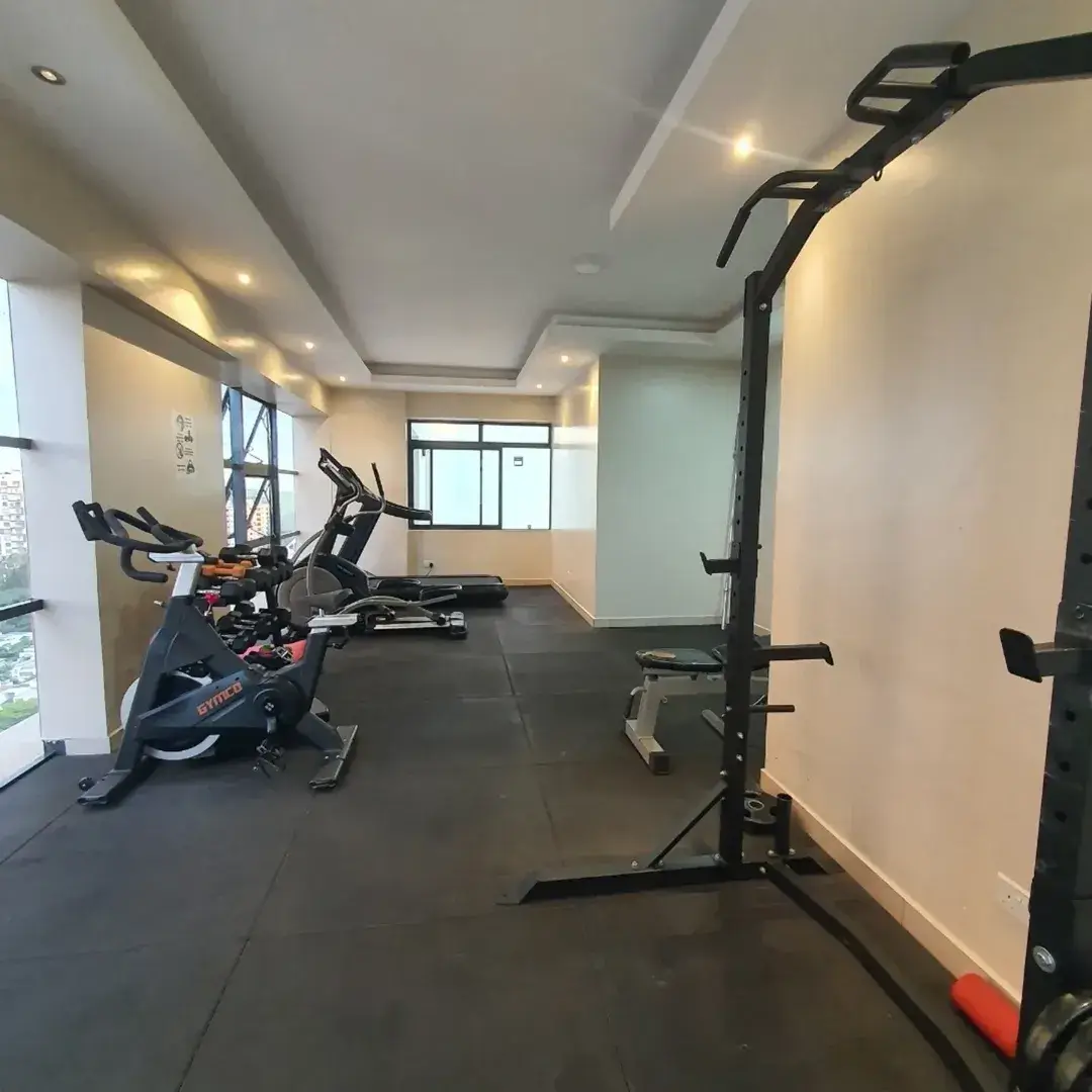 Modern gym with stationary bikes and weight training equipment