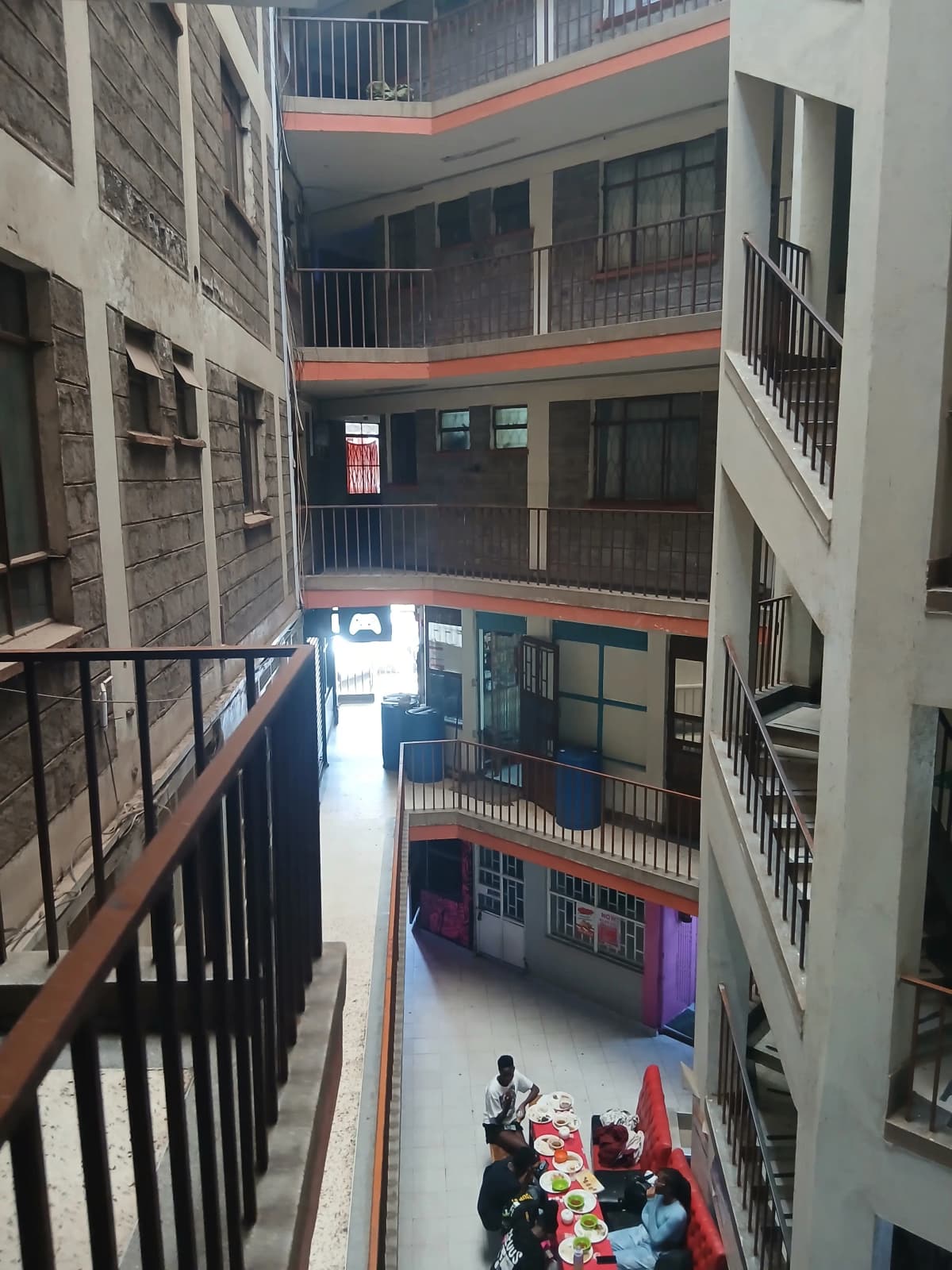 Multi-story building atrium with central courtyard and stairwell