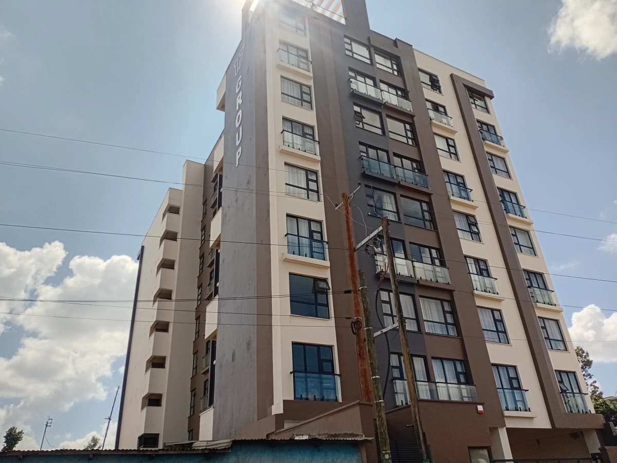 Multi-story residential apartment building facade with balconies