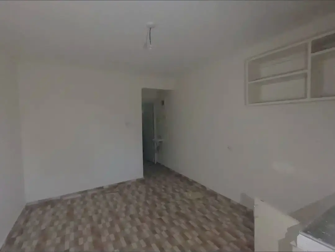 Unfurnished bedroom with built-in storage cabinet