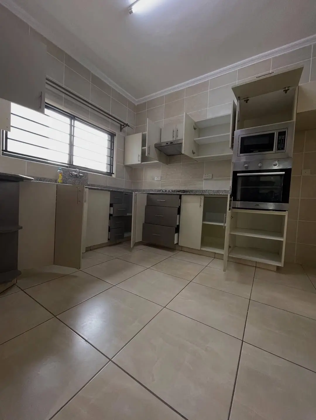 Modern kitchen with built-in appliances and ample cabinetry