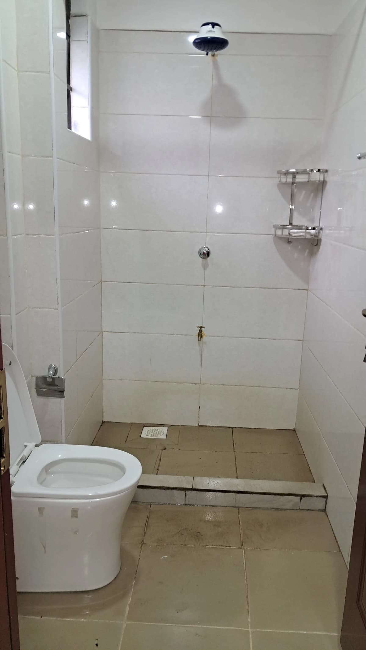 Modern bathroom with walk-in shower and white tile finish
