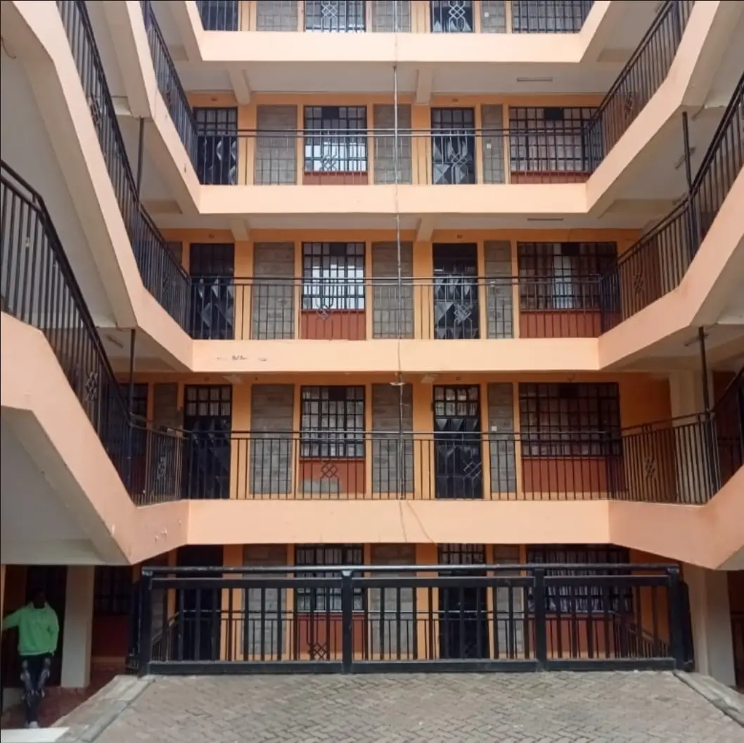 Multi-story residential building atrium with balconies