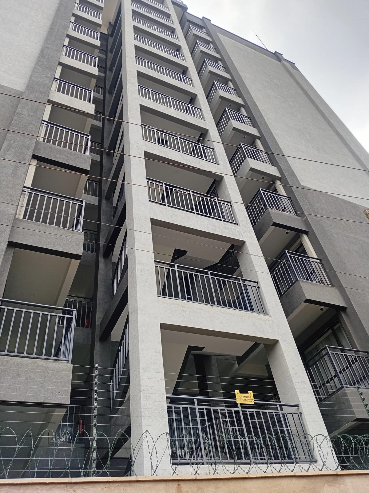 Modern apartment building facade with multiple balconies