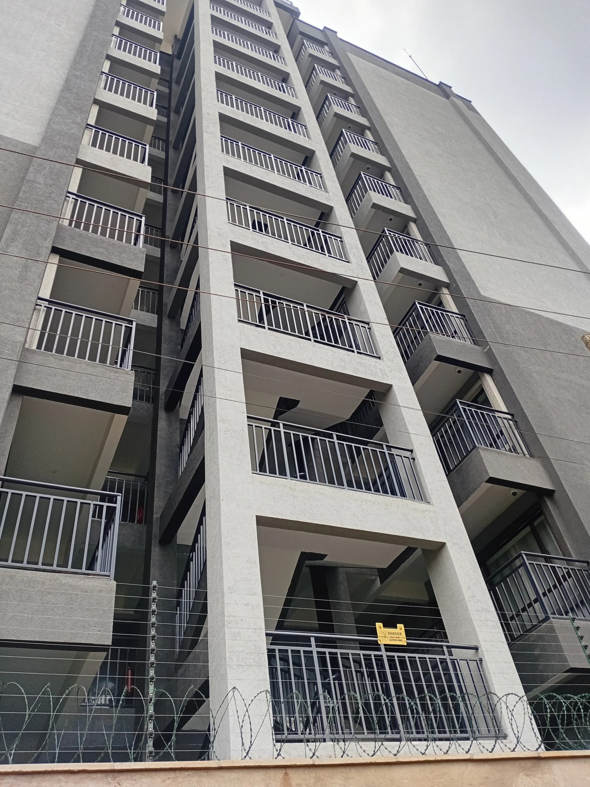 Modern apartment building facade with multiple balconies