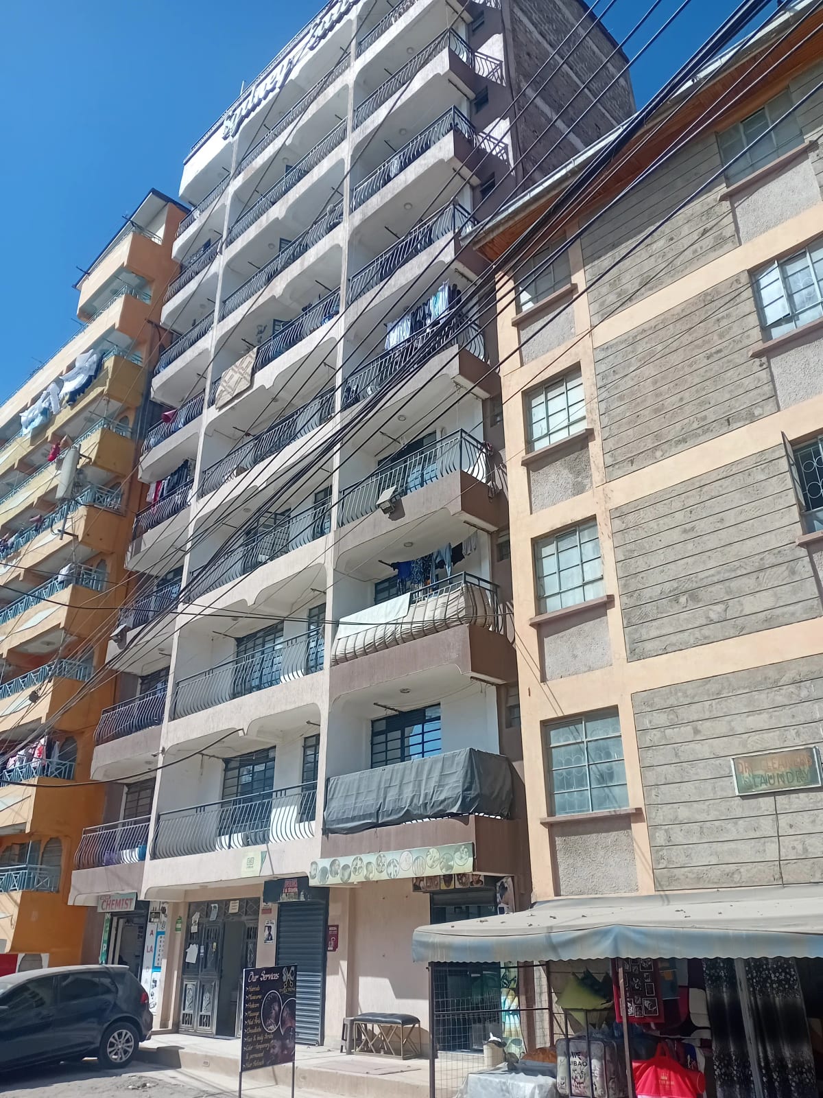 Multi-story residential building facade with balconies and windows