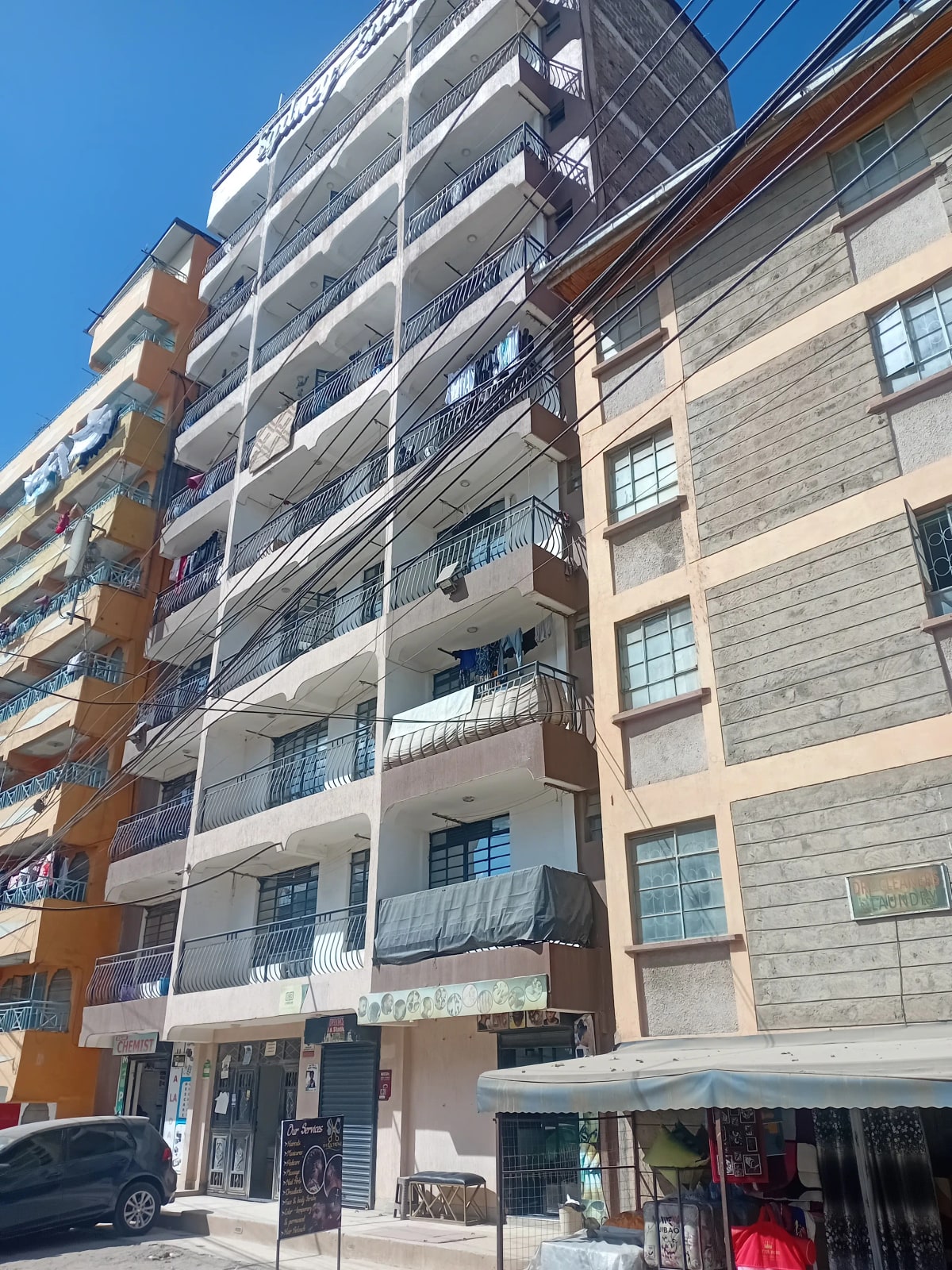Multi-story residential building facade with balconies and windows