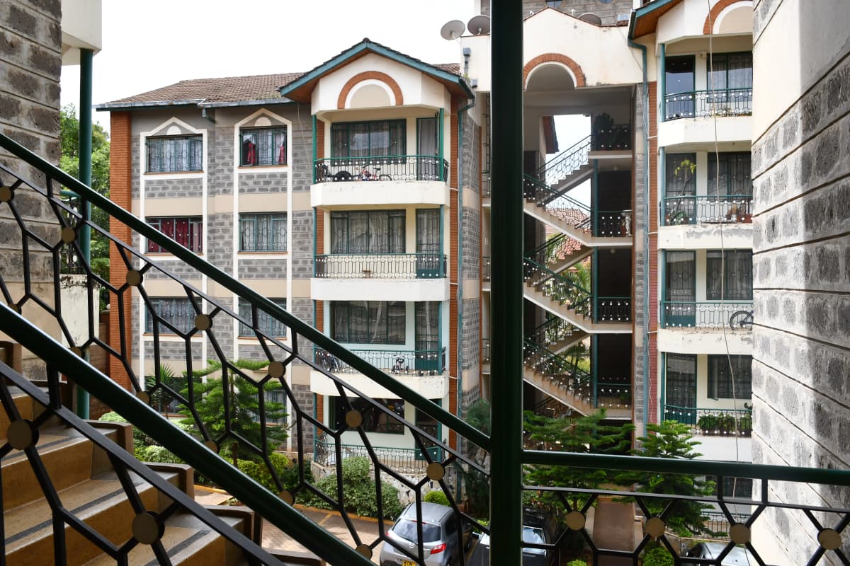 Balcony view overlooking residential apartment complex courtyard