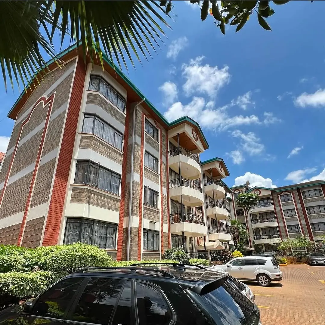 Multi-story residential building with brick facade and balconies