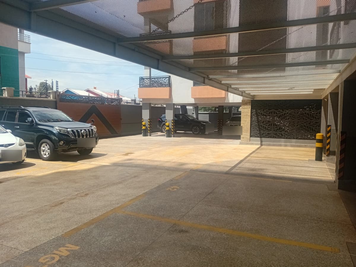 Covered parking area with multiple vehicle spaces