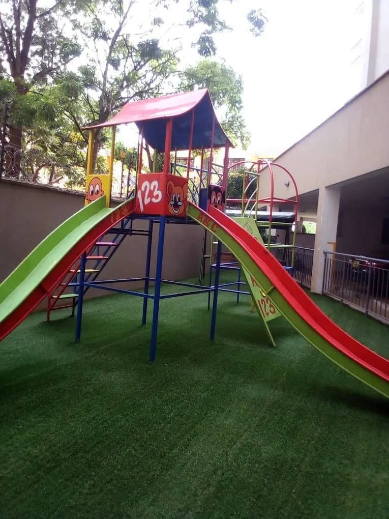 Residential playground with colorful slides and climbing structure