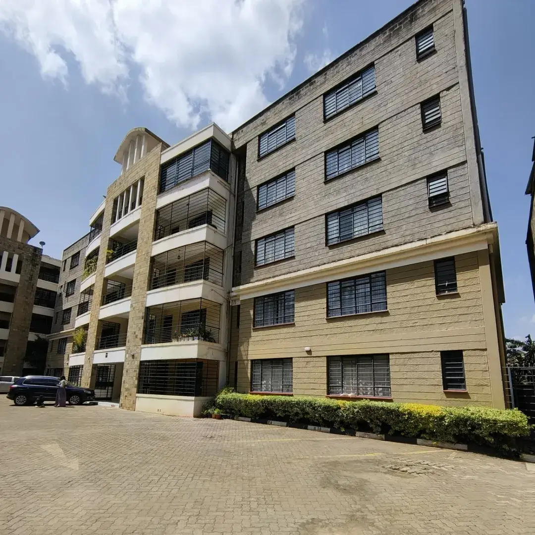 Modern multi-story residential building with stone facade