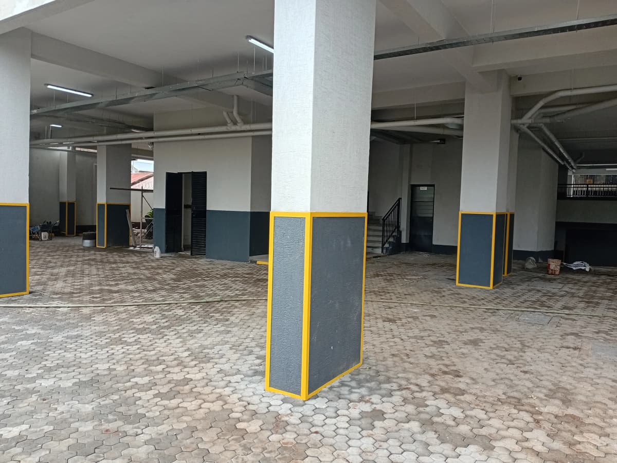 Underground basement parking garage with yellow-marked pillars
