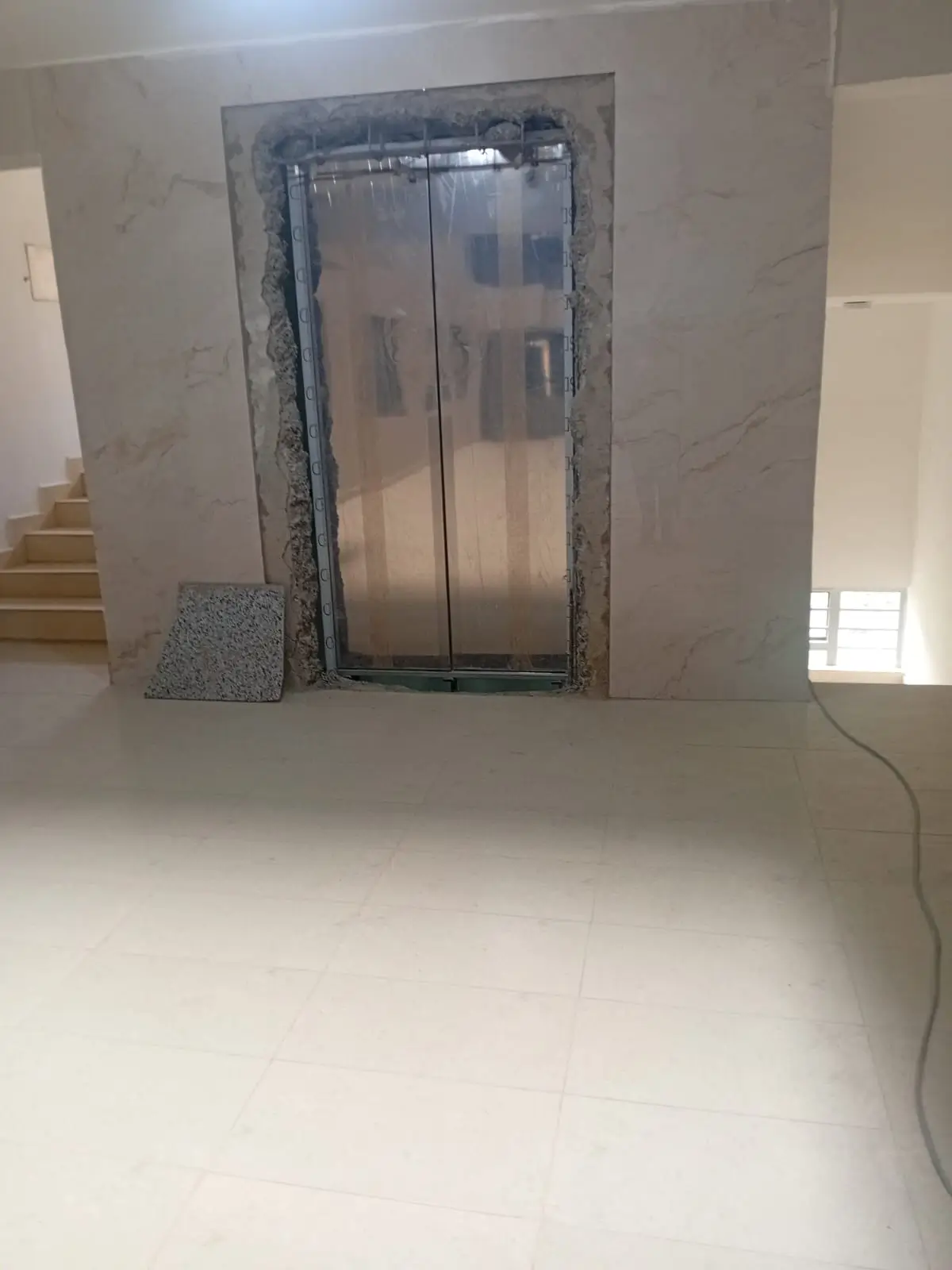 Building lobby with elevator installation in progress