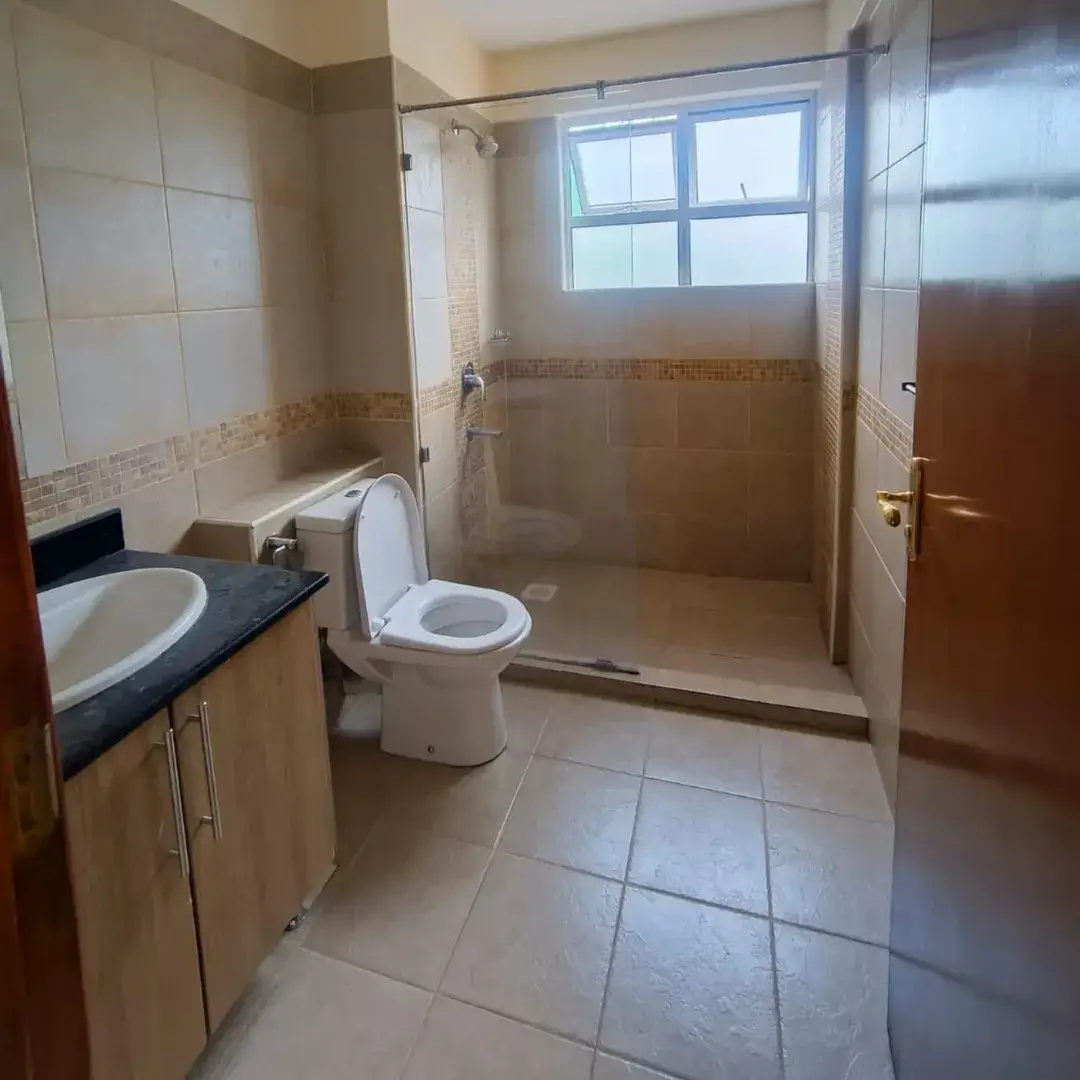 Spacious bathroom with shower enclosure and dual vanity sink