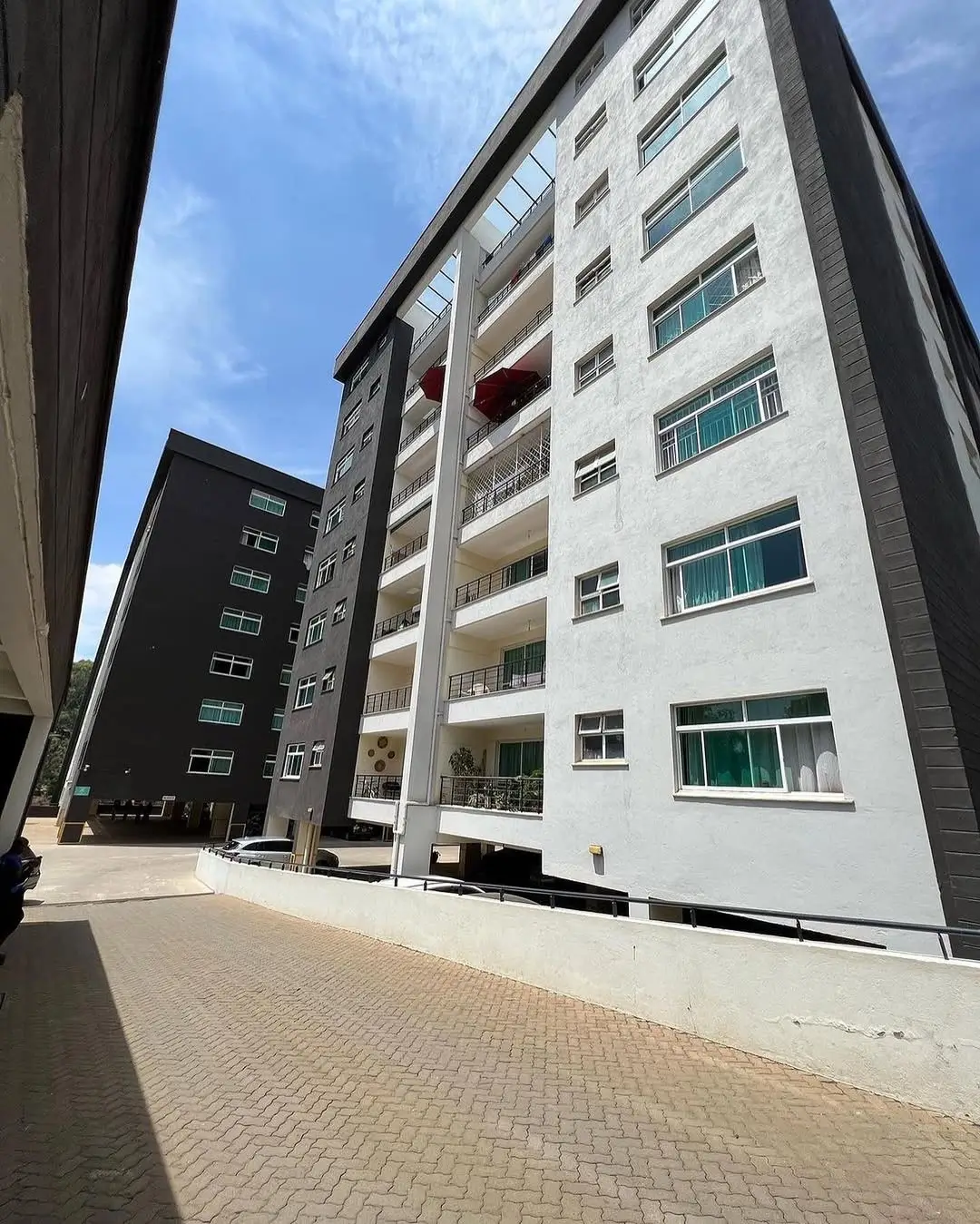 Modern multi-story residential building facade with balconies