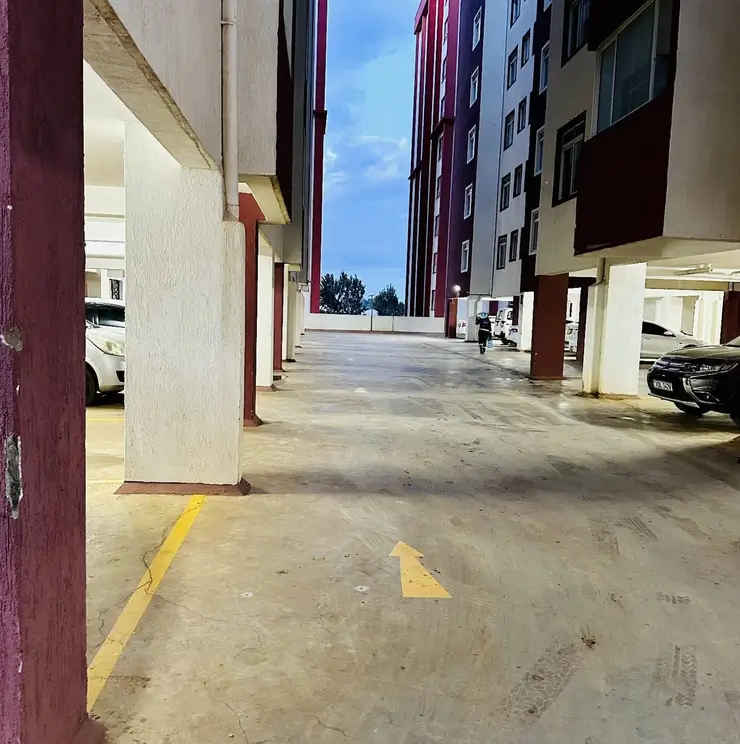 Multi-level underground parking area with yellow markings
