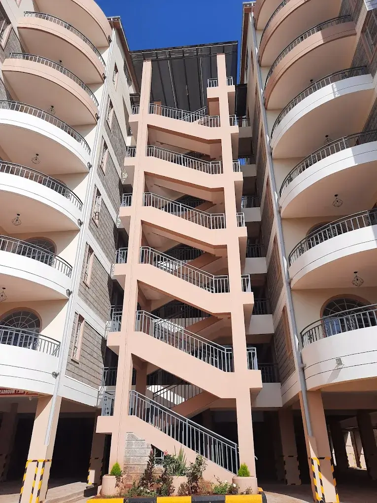 Modern multi-story residential building with curved balconies