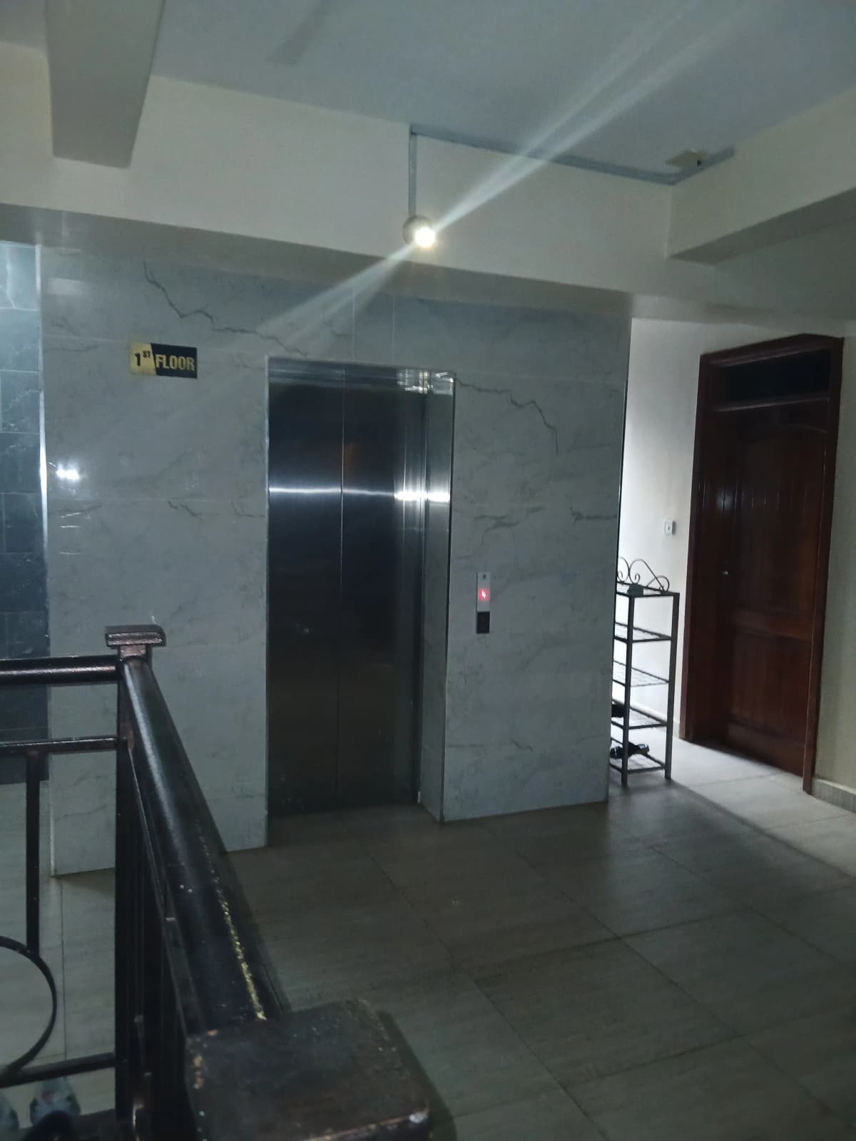 Building lobby with elevator and tiled flooring