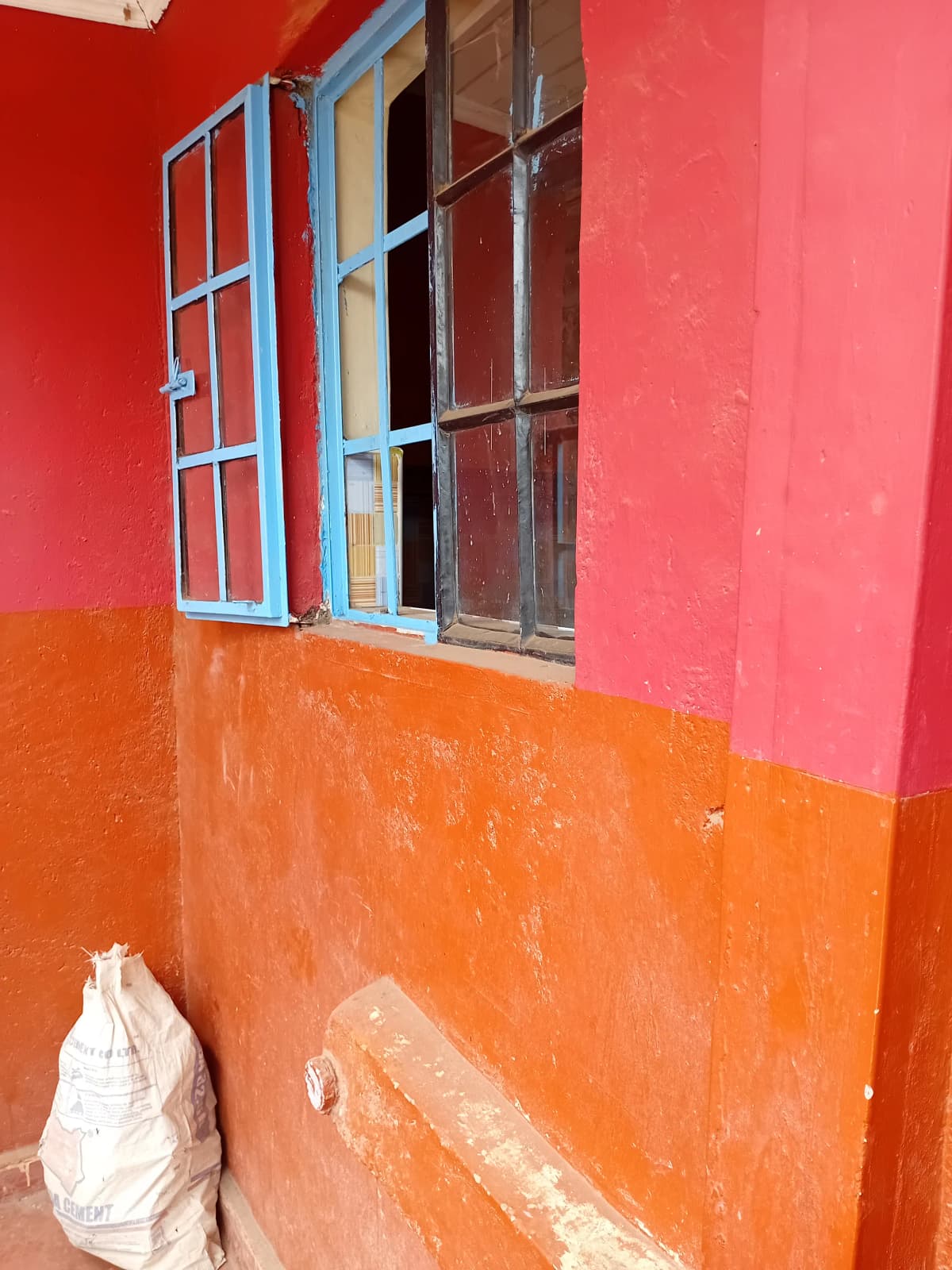 Building exterior wall with colorful red and orange paint