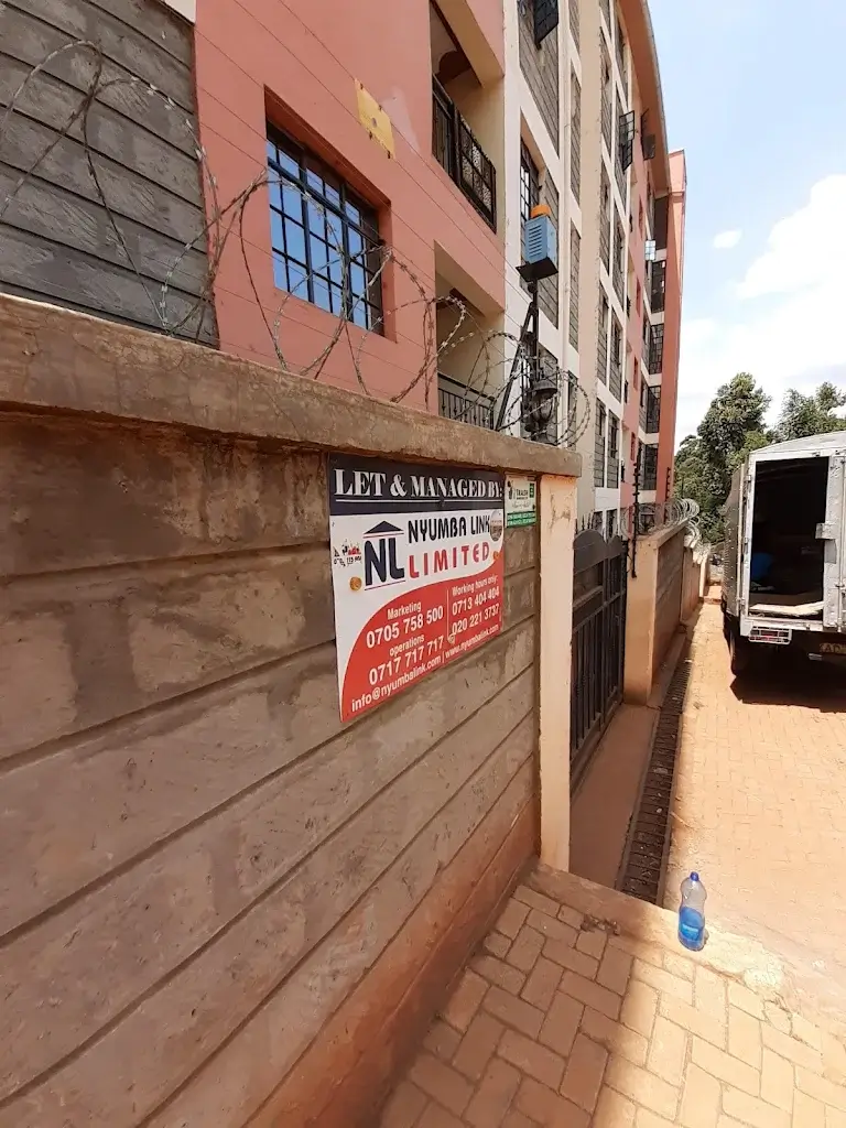 Building facade with entrance gate and signage