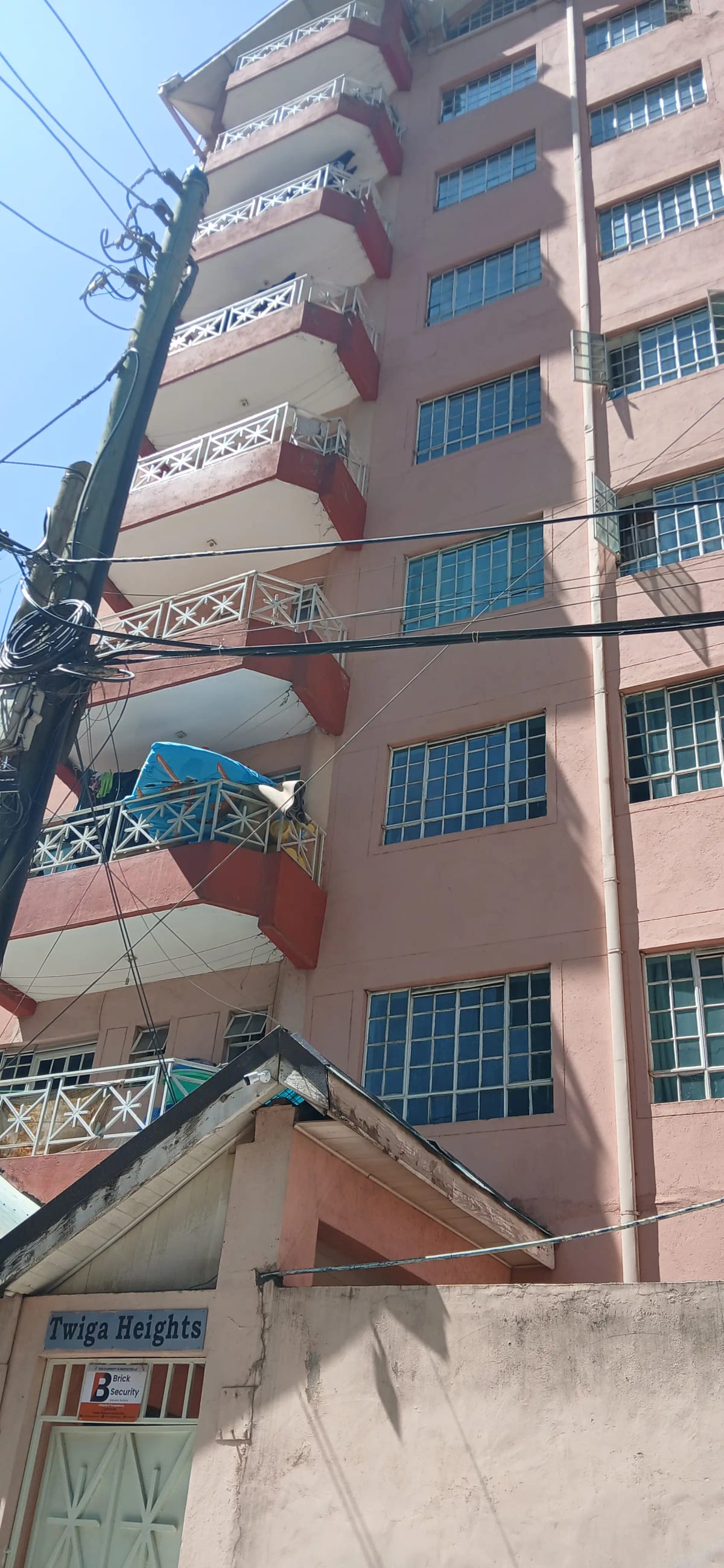 Multi-story residential building facade with balconies and windows