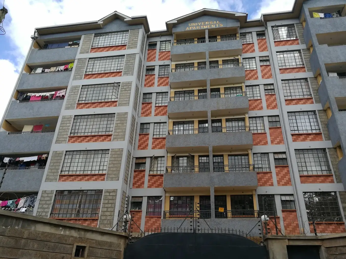 Modern multi-story residential building facade with balconies