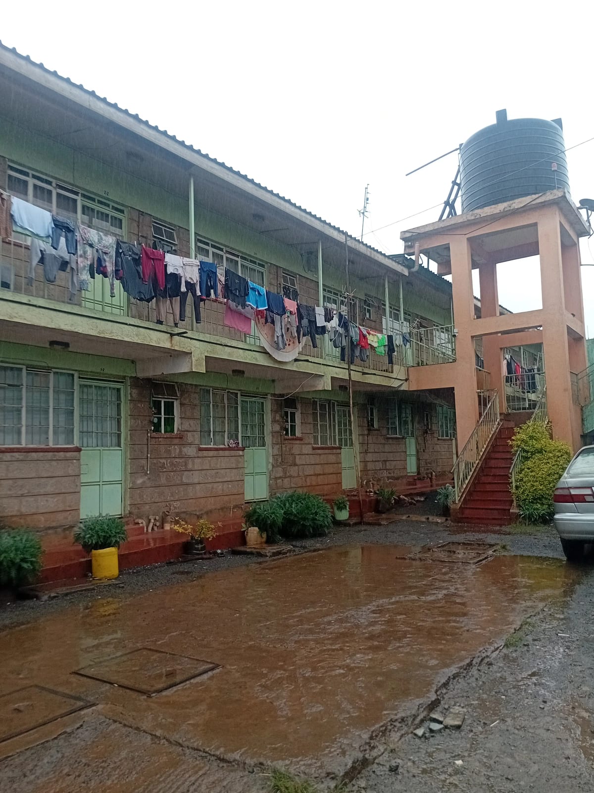 Multi-story residential building with wet compound and laundry