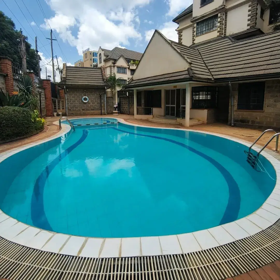 Large circular swimming pool with pristine turquoise water