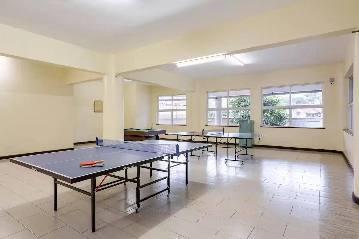 Spacious recreation room with multiple ping-pong tables
