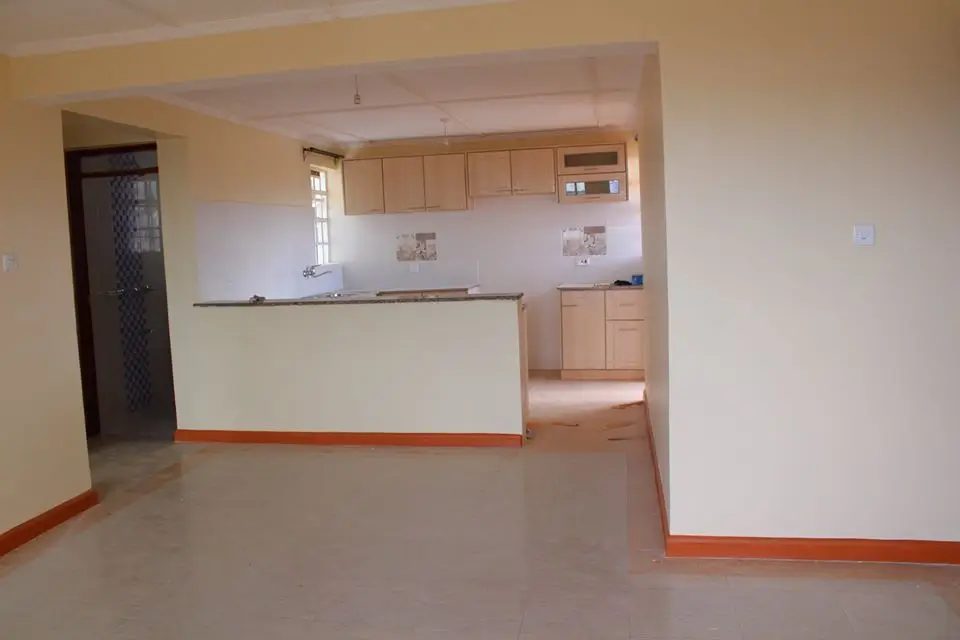 Open-plan living area with integrated kitchen counter visible