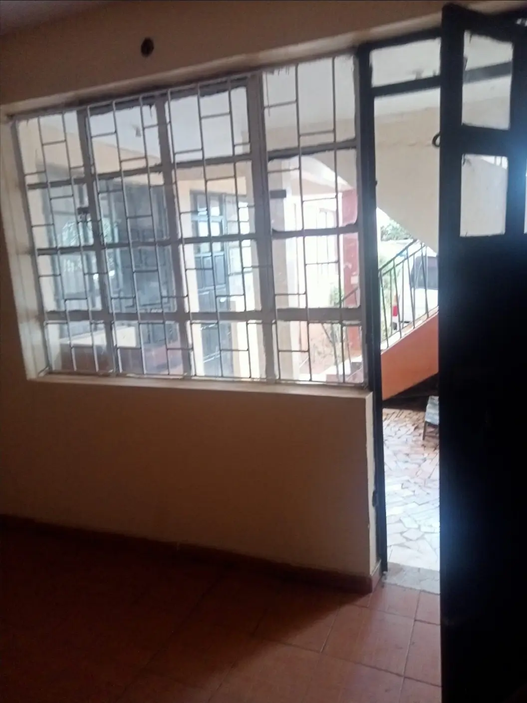 Building corridor with gridded glass partition and railing