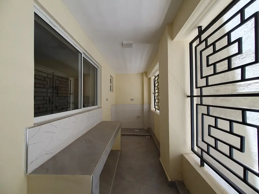 Narrow corridor with marble countertop and decorative wall art