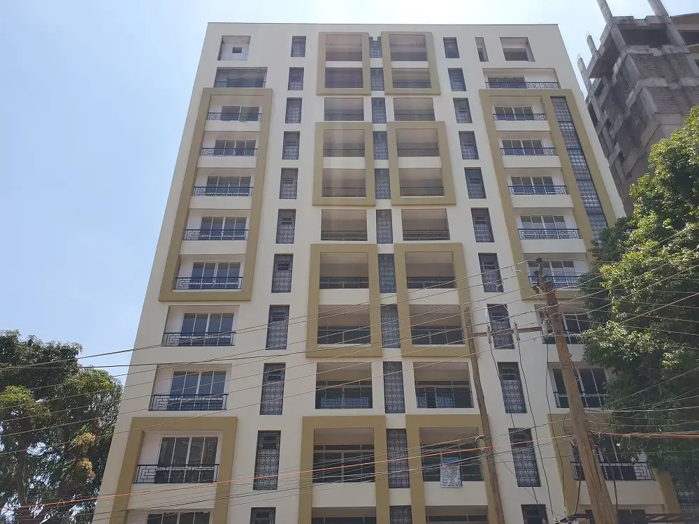 Multi-story residential building facade with balconies and windows