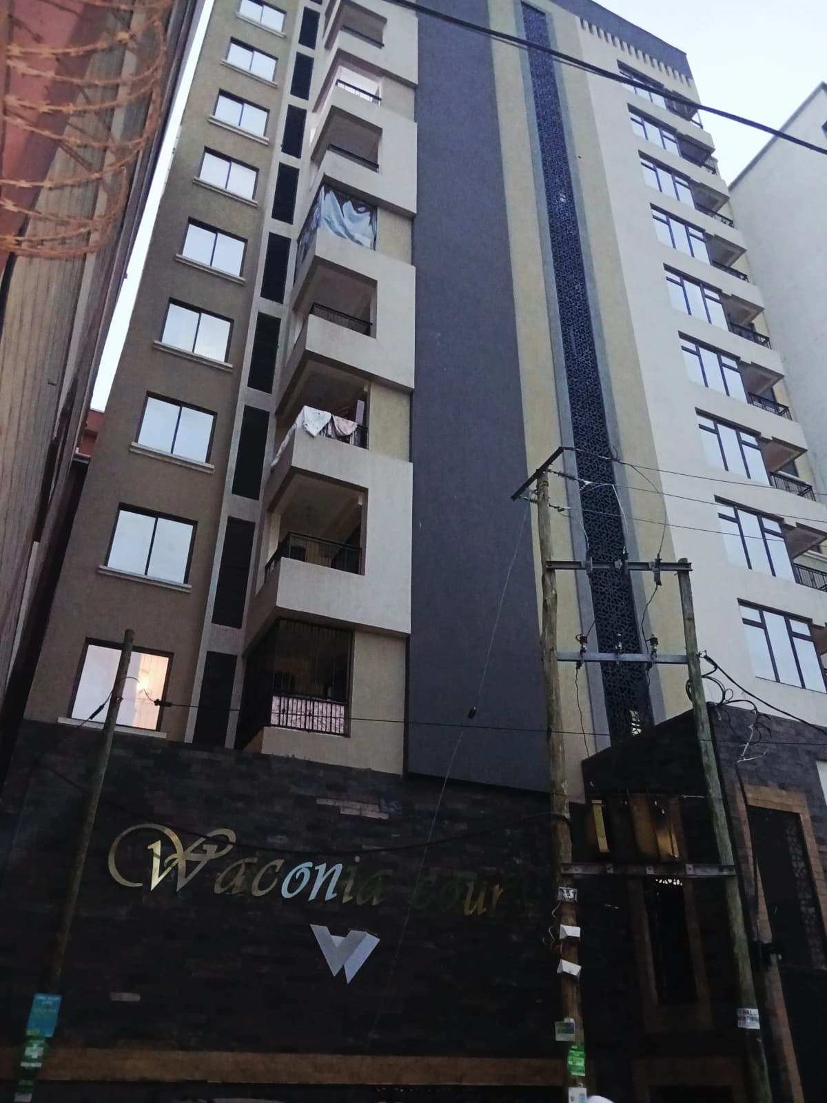 Modern multi-story residential building facade with balconies
