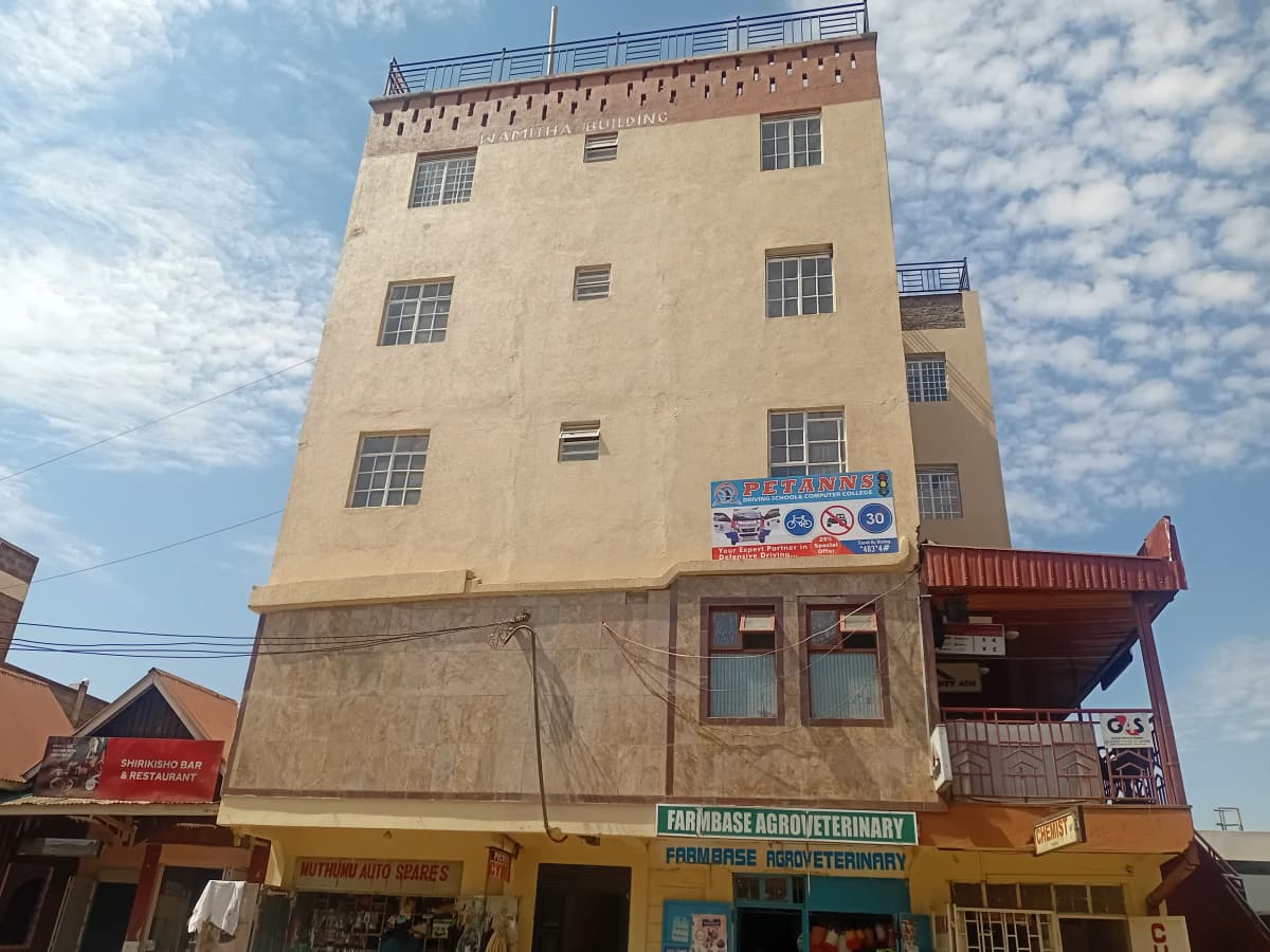 Multi-story residential building facade with commercial ground floor