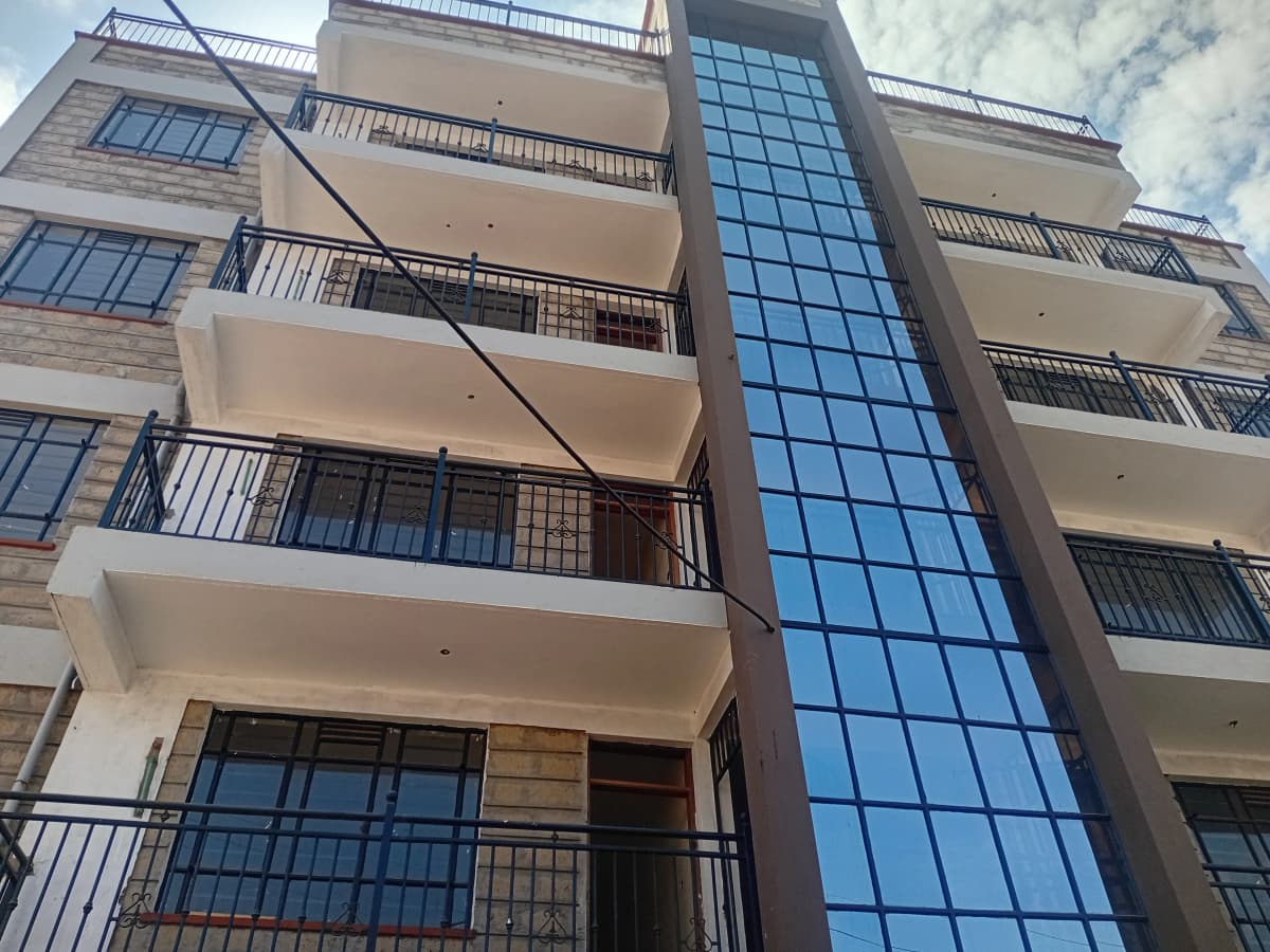 Modern multi-story residential building facade with balconies